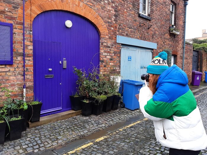 Photograph being taken of blue door