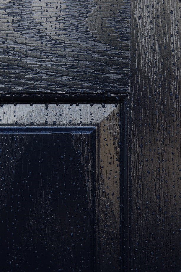 Close up of rainfall on a composite door